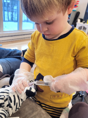 Dr. Bryce taking care of his zebra's picc line - just like Sister Girl!