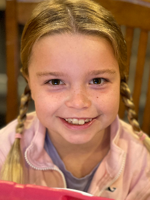 Our beautiful girl's smile lights up the room!