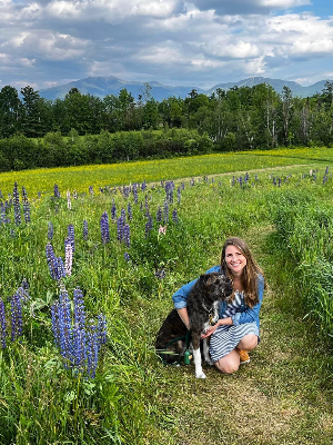 Emily with Penny - Enjoying the lupines (photo by Mike)